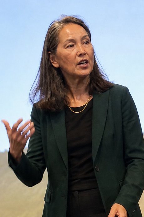Maria Lee speaking on stage